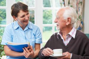 Residents gathered in a decorated common room, sharing a holiday meal and enjoying festive decorations.