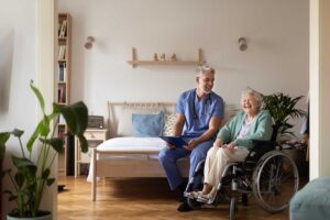 Elderly residents participating in a small group religious or cultural activity in a community common room.